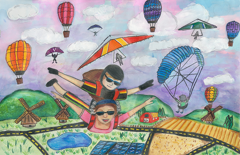 Paragliders, a handglider, and hot air balloons