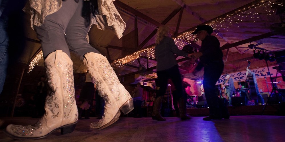 Woman western dancing with white boots