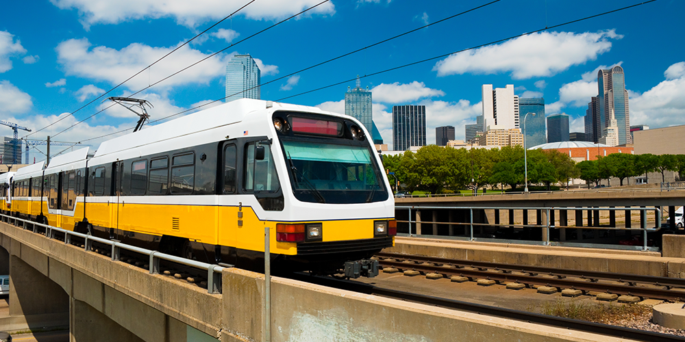 Light rail train and Dallas skyline