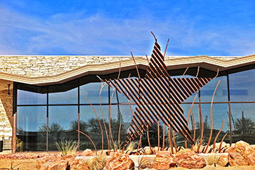 View of a Star sculpture in front of the new building