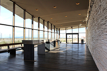 View inside the lobby area with panoramic window view of distance mountains