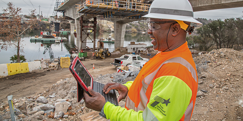 TxDOT employee using ipad on construction site