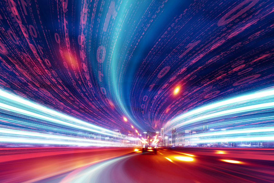 A photo illustration showing an illuminated road with data above it.