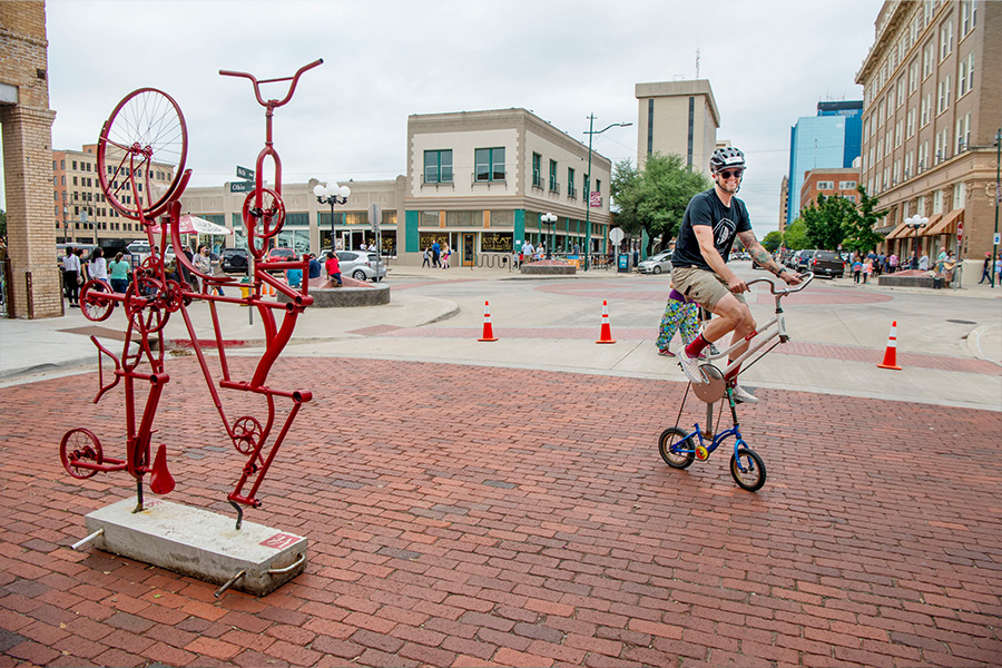 Cyclist on custom bicycle