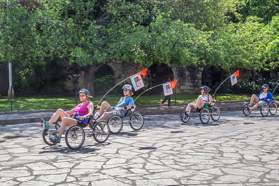 Cyclists on recumbent trikes