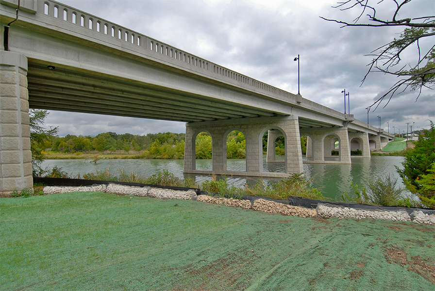 View of a highway bridge showing the vegetation after seeding