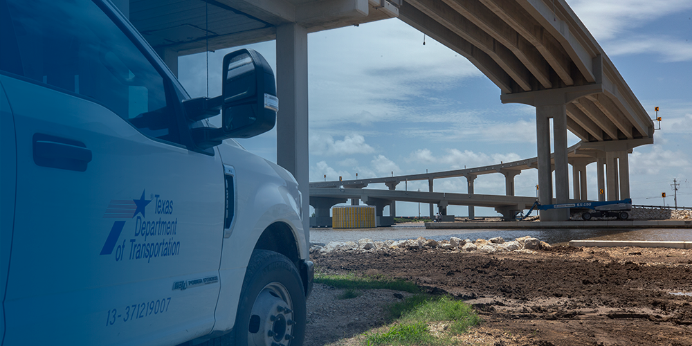 txdot truck with highway in background