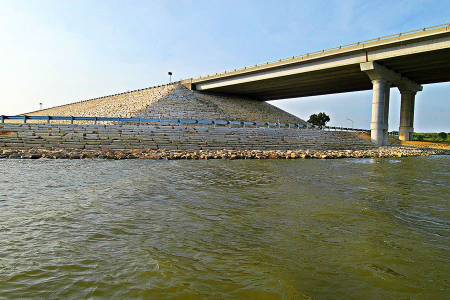 Water with bridge and rock retaining wall