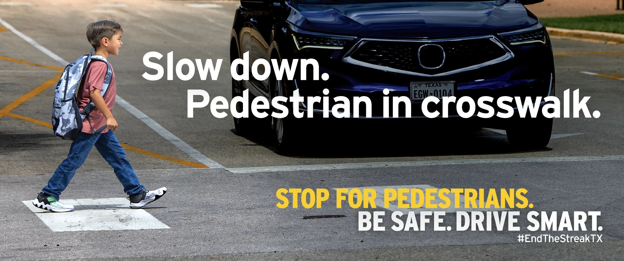 Slow down Pedestran in crosswalk. Child crossing street in front of car.