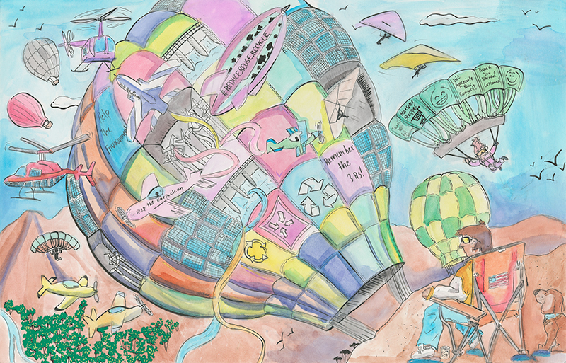 Hot air balloons with skydivers and a hangglider above a flag waver