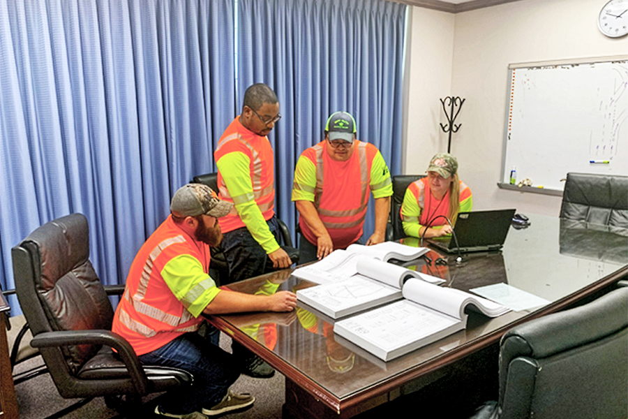 TxDOT employees discuss bridge follow-up actons.