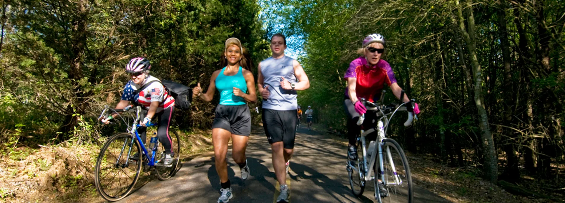 Joggers and cyclists on trail