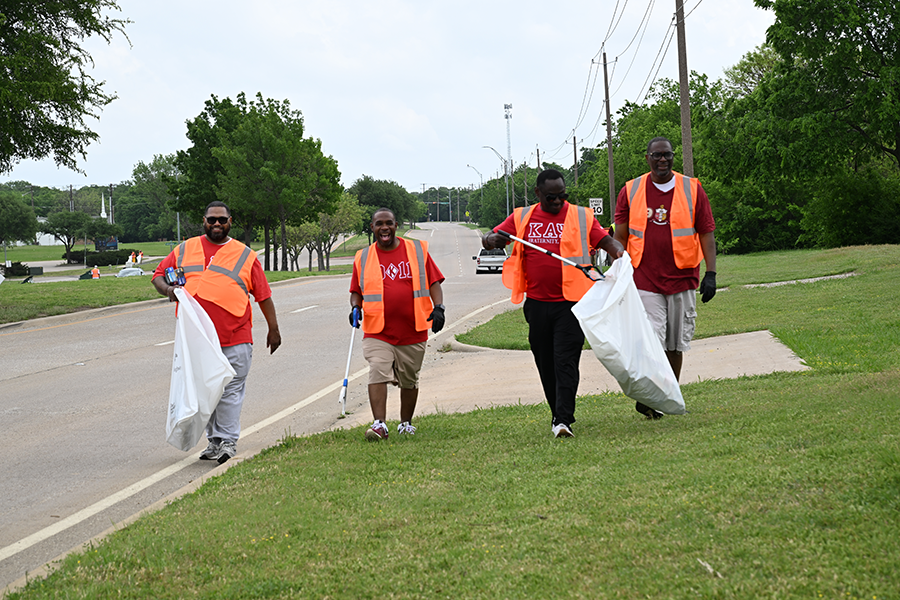 Volunteers participate in Adopt-a-Highway's Trash Off in Denton, Texas. 