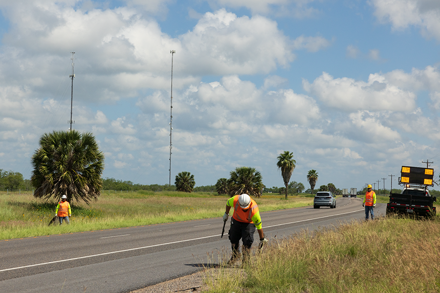 txdot crew cleans debris on road 