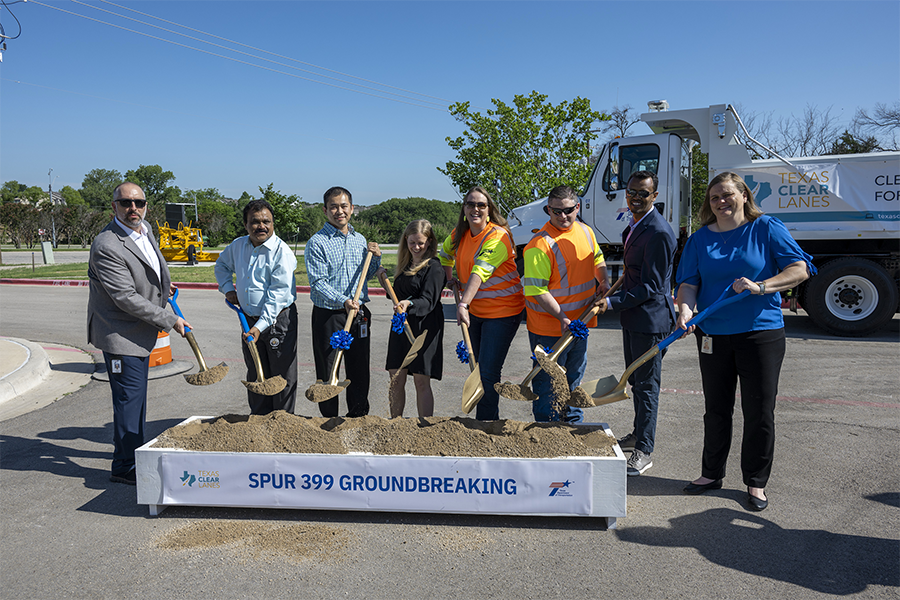 Spur 399 groundbreaking Employees and officials with shovels turn over soil at Spur 399 groundbreaking ceremony