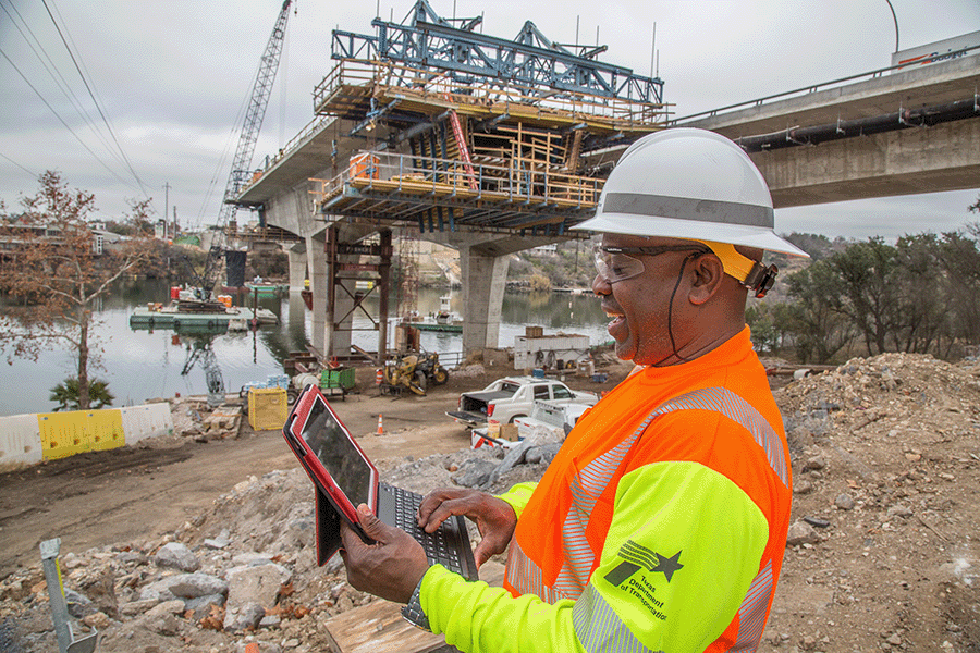 TxDOT employee using ipad on construction site