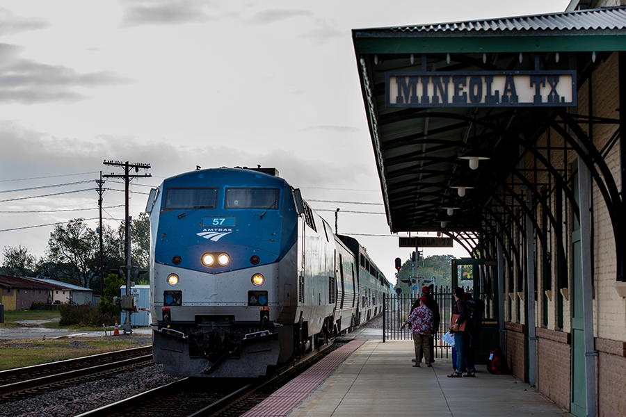train moves through Mineola Station