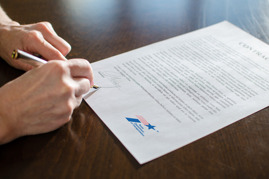 Hand signing a TxDOT contract