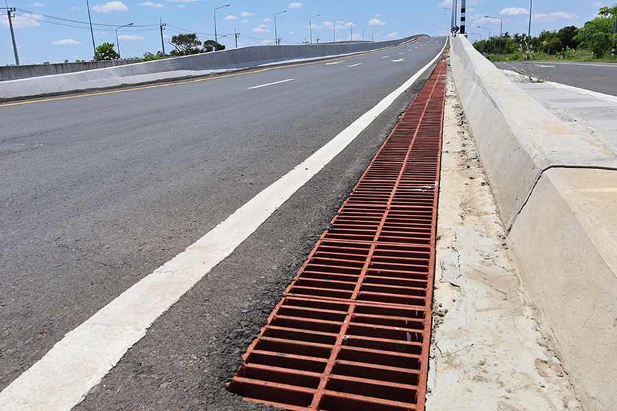 Storm drains along the side of a road