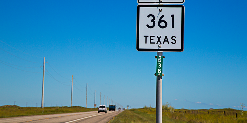 Reference marker sign on side of state highway