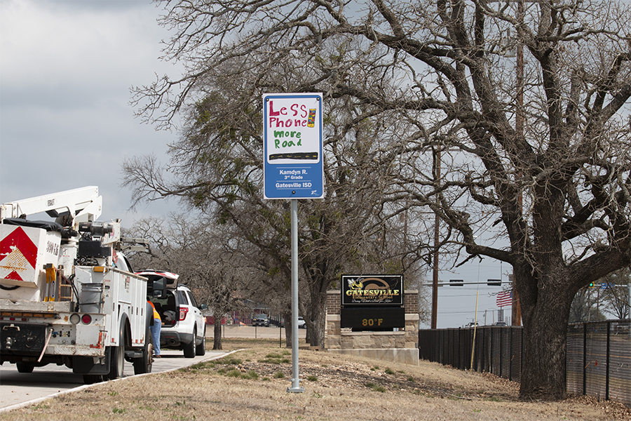 Waco sign contest, "Less phone More road" signage