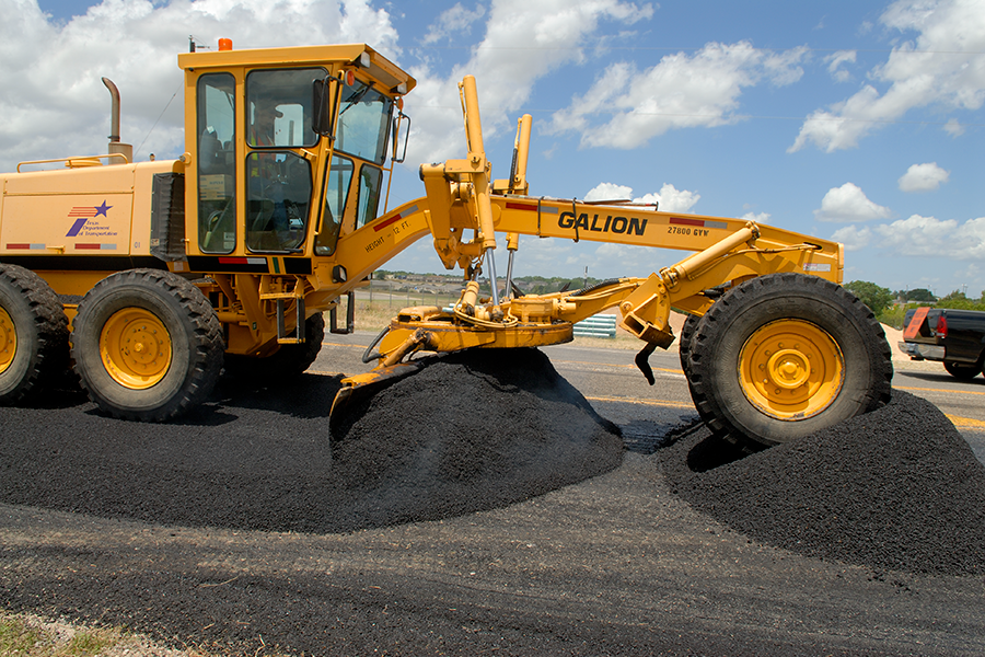 Grader with asphalt