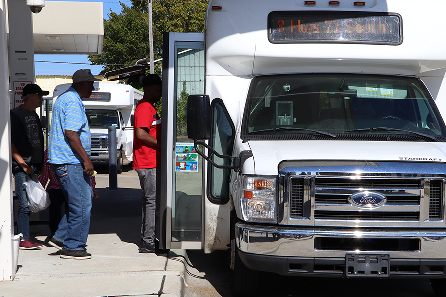 Riders boarding public transportation bus