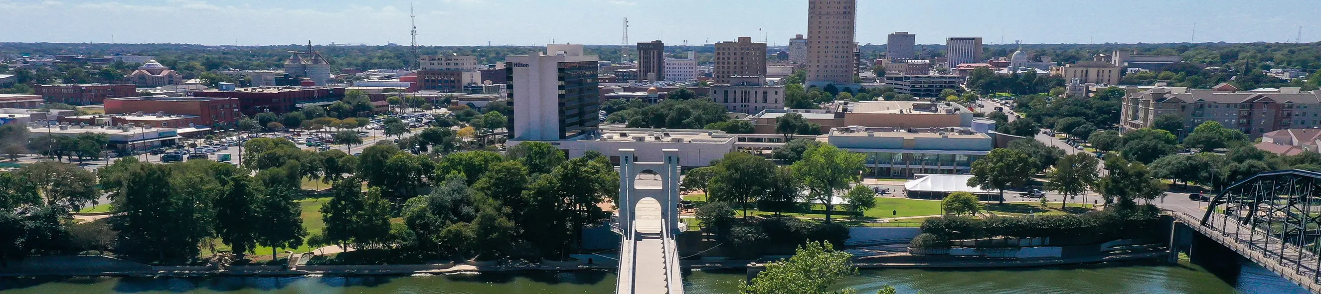 Waco skyline with river and bridge in foreground