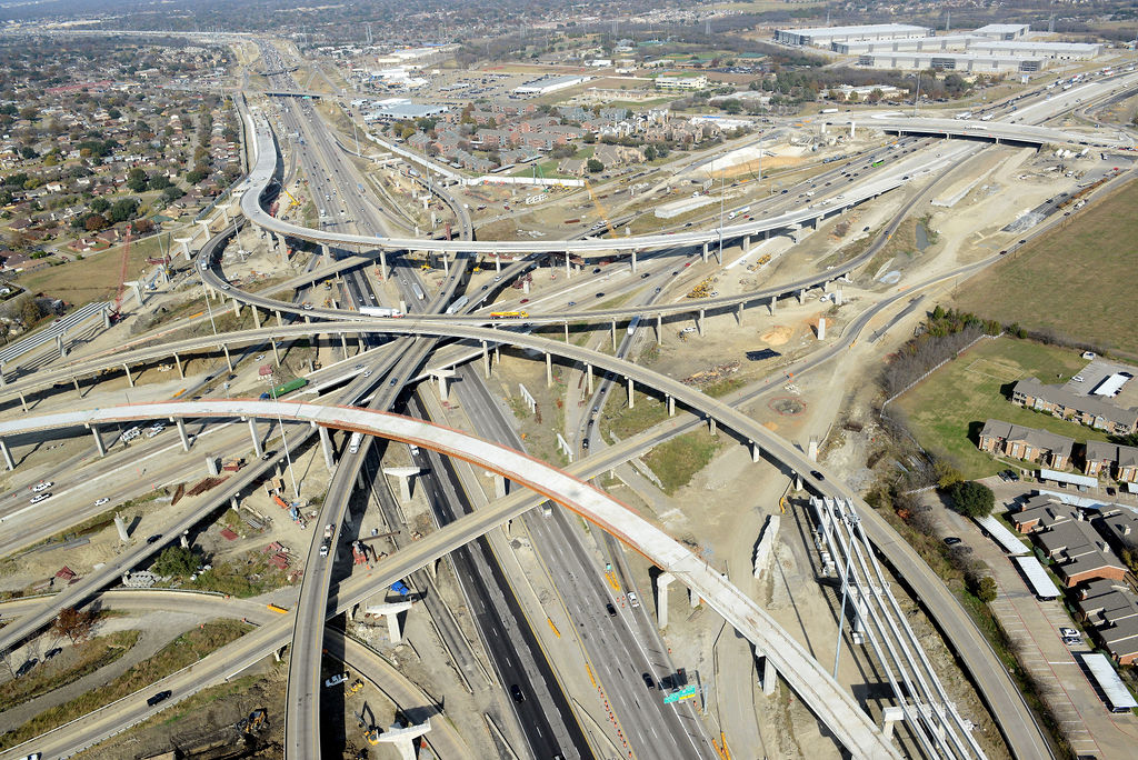 Aerial view of I-635 East interchange. Construction of overpass direct connector, ramp, detours, closures, lanes, and traffic in 2021.
