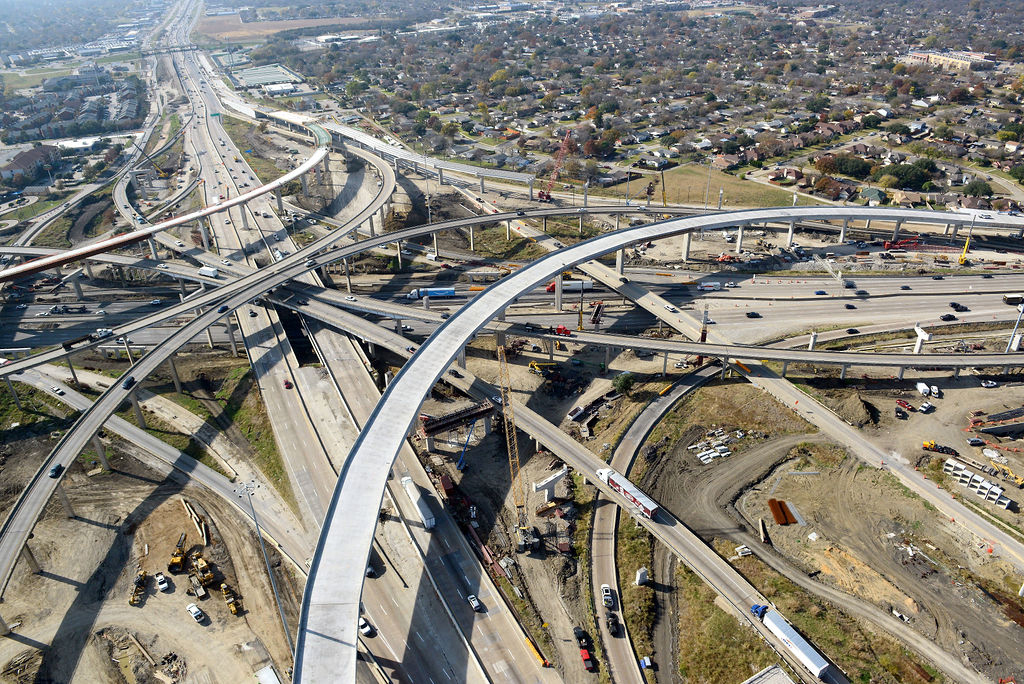 Aerial view of I-635 East interchange. Construction of overpass direct connector, ramp, detours, closures, lanes, and traffic in 2021.