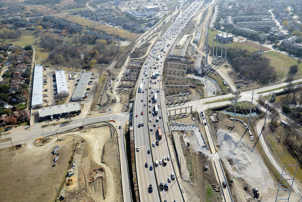 Aerial view of I-635 East at La Prada Dr. Construction of piers, overpass, ramp, bridge, frontage road, lanes, expansions, descking, closures, and detours in 2021.