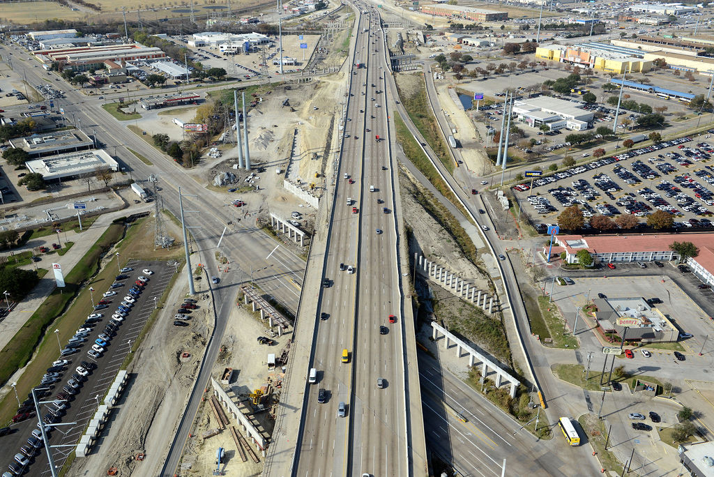 Aerial view of I-635 East at Leon Rd and Northwest Hwy. Construction of piers, overpass, ramp, bridge, frontage road, lanes, expansions, descking, closures, and detours in 2021.