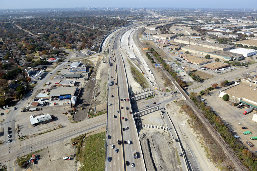 Aerial view of I-635 East at Church Rd and Plano Rd. Construction of piers, ramp, overpass, expansions, lane closures, detours, and traffic in 2021.