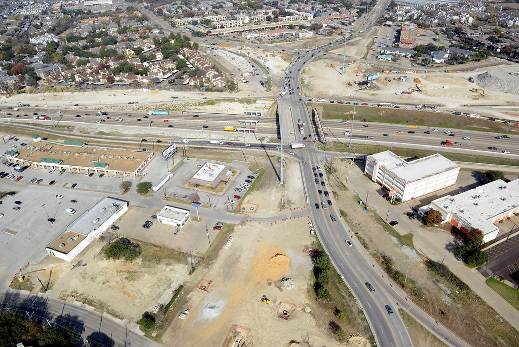 Aerial view at Skillman Street in 2021, looking north at the intersection, showing foundations installed for the temporary bridge to be built just west of the Skillman bridge.