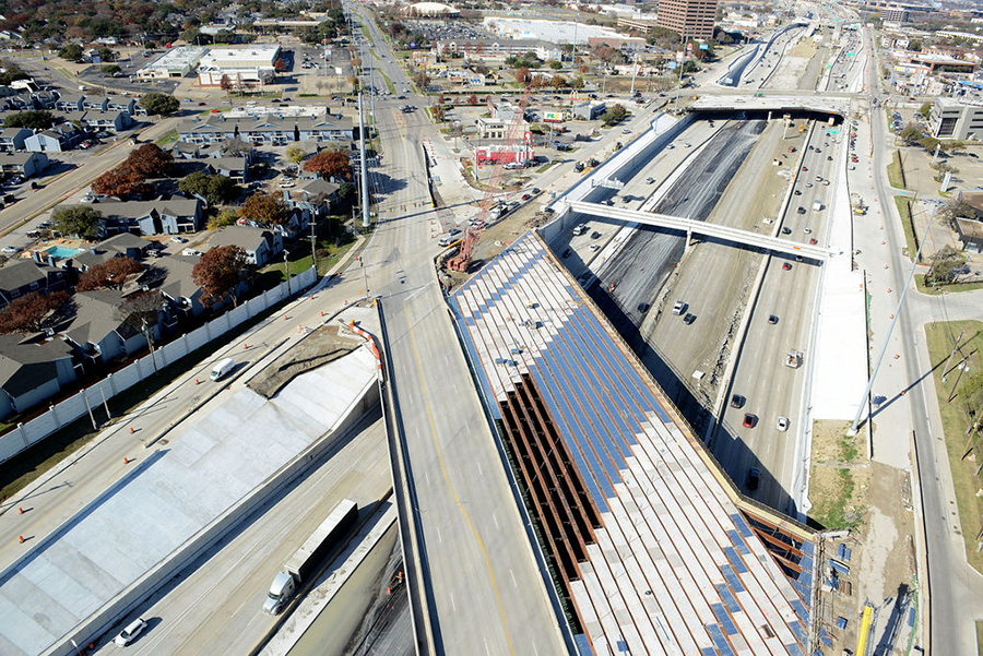 South view of Forest Lane at I-635 showing beams of new bridge sections, expanding the overall width of the cross street