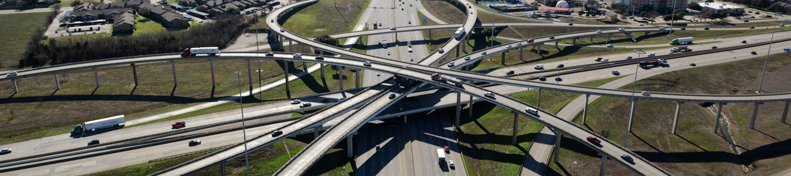 Eastbound westbound I-635 and eastbound westbound I-30 intersection aerial view of direct connectors.