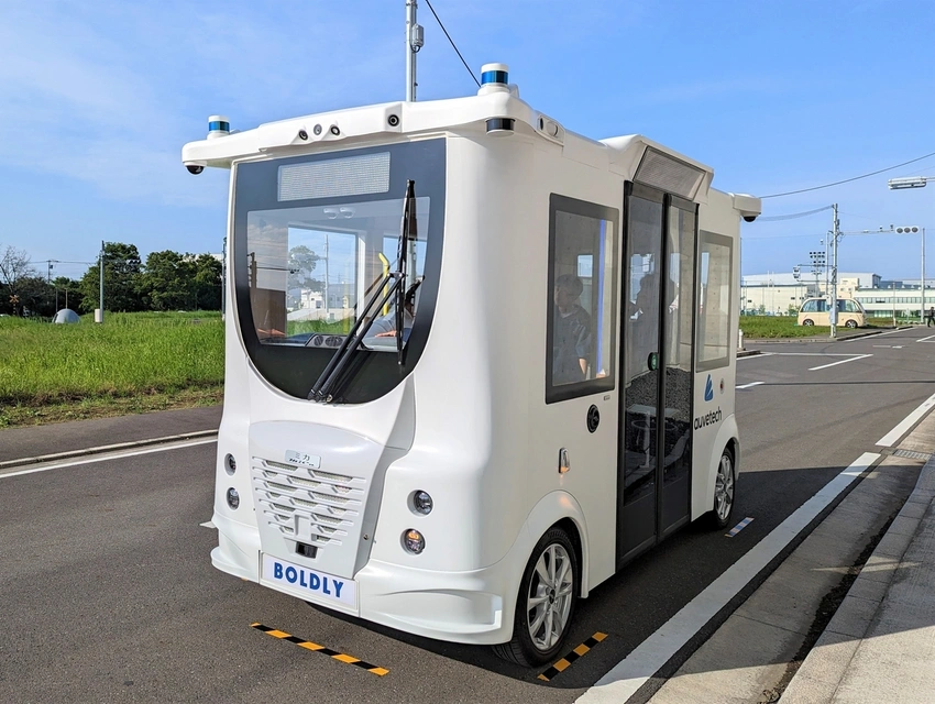self-driving bus parked on road