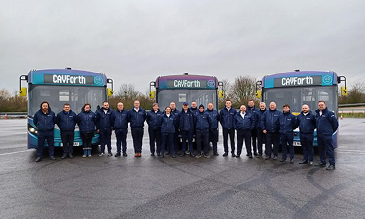 group photo with autonomous buses