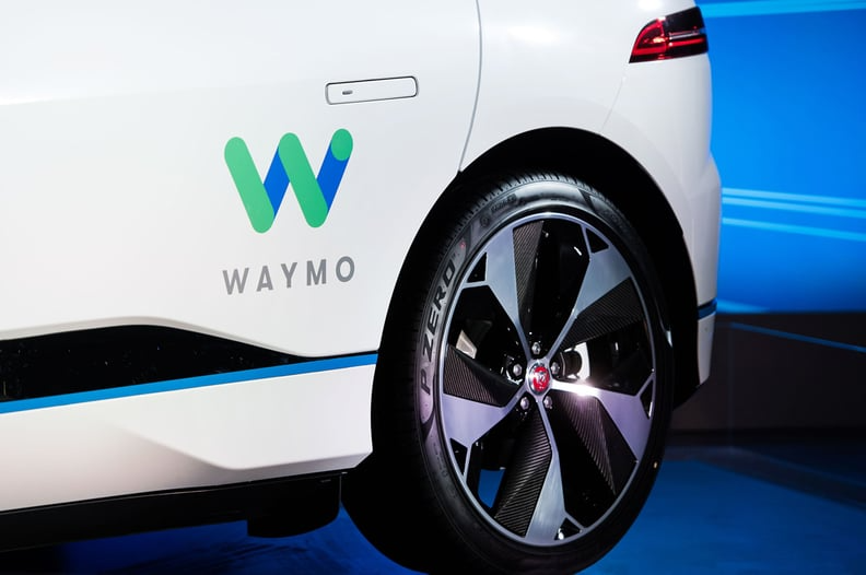 Waymo logo on car side door