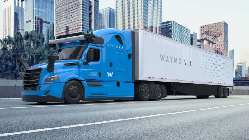 Waymo autonomous truck driving by city 