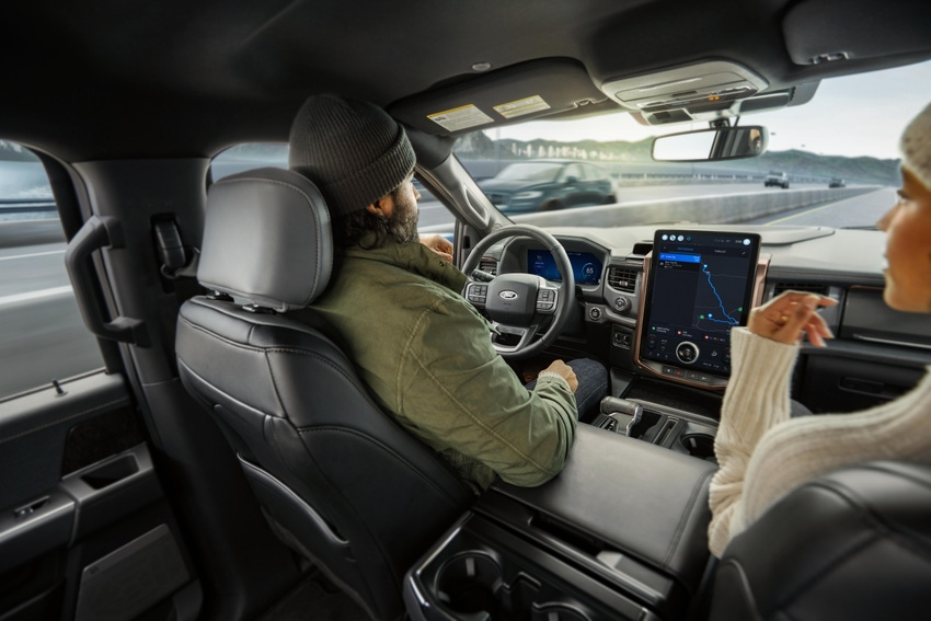 driver and passenger in self-driving car