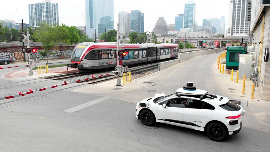 autonomous car stopped at train crossing