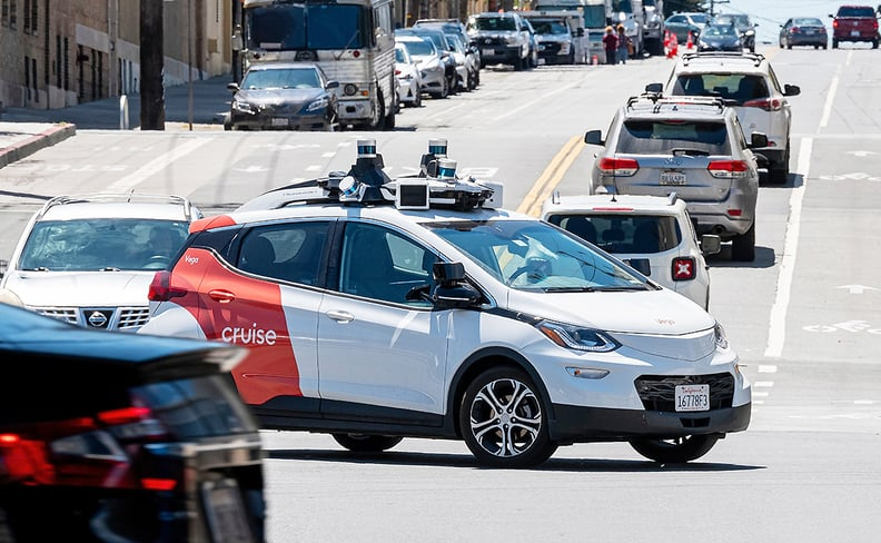 autonomous vehicle crossing city traffic