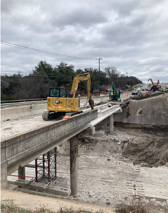 Northbound I-35 frontage road at Walnut Creek bridge construction - February 2024