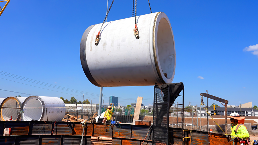 Crane lifts 16-ton pipe into air