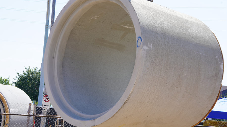 Crane lifts pipe into the air