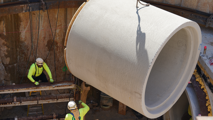 Pipe reaches crew members in pit