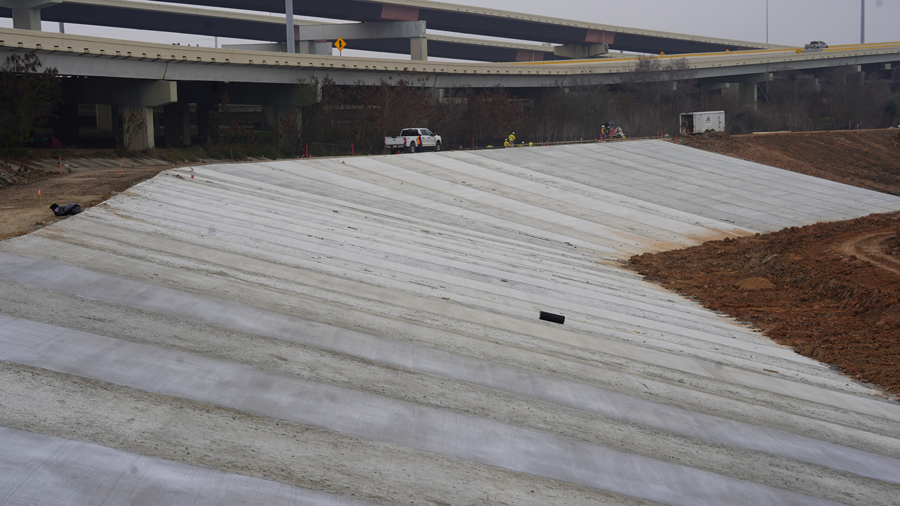 The concrete pour on the west side of the pond is almost done