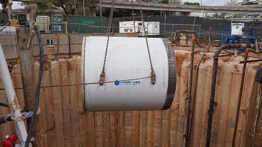 Pipe lowered into hole 64 feet deep.