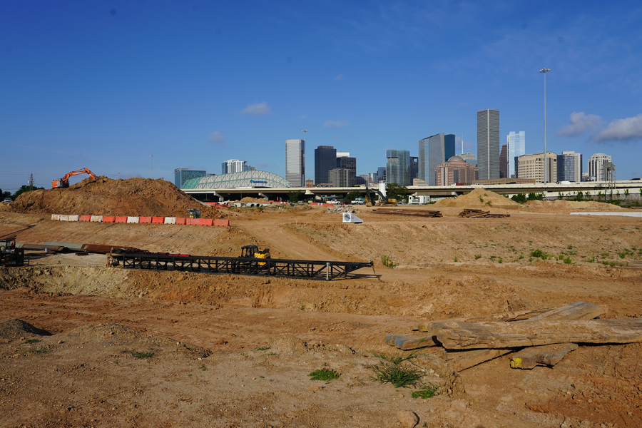 Wide shot of detention pond looking toward downtown Houston